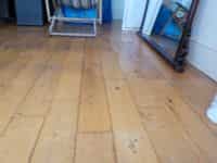 Uneven floor due to damp and lack of expansion joints